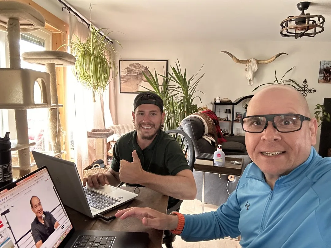 Paul Meyers and Brody Martin of Martin Services at the table on laptops, building the marketing plan for the landscaping and hardscaping push
